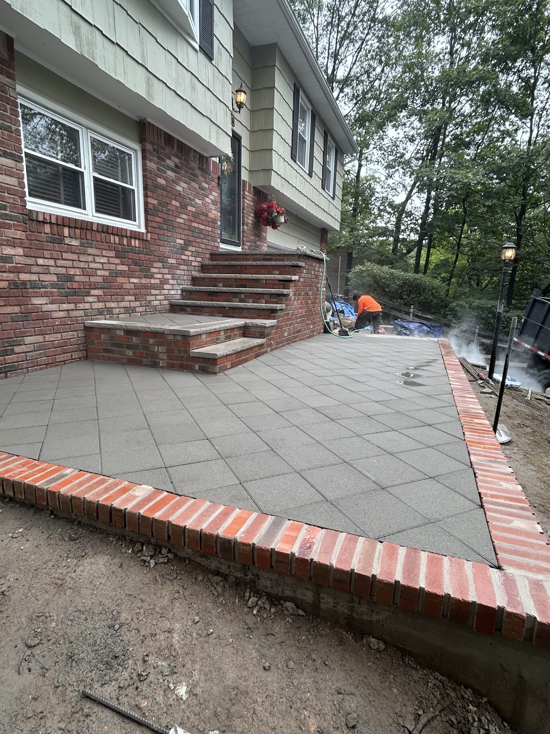Alberto Rivera reviewing a property for hardscaping in Dover, NJ